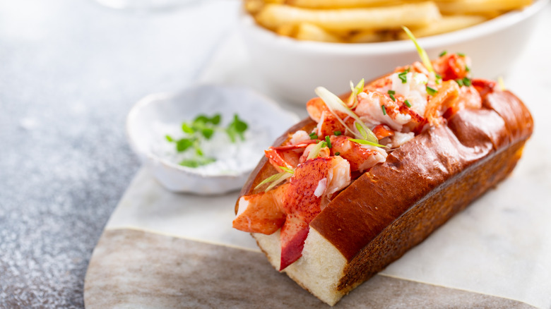 lobster rolls with sauce and fries