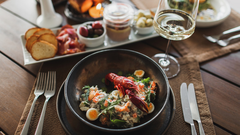 fancy lobster dish with wine
