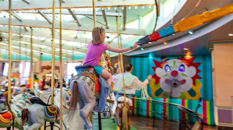 Tossing the rings on the Looff Carousel at the Santa Cruz Beach Boardwalk