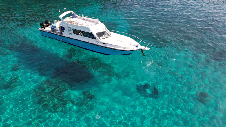 Boat on crystal clear waters in Bali