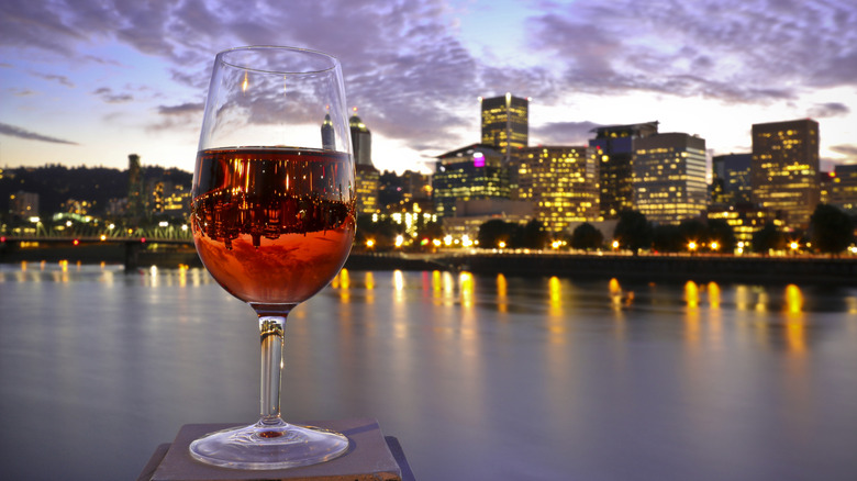 Glass of wine with Portland, OR, skyline in background