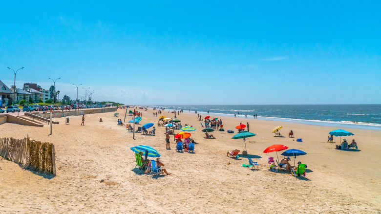Beachgoers enjoying Playa Carrasco in Montevideo, Uruguay