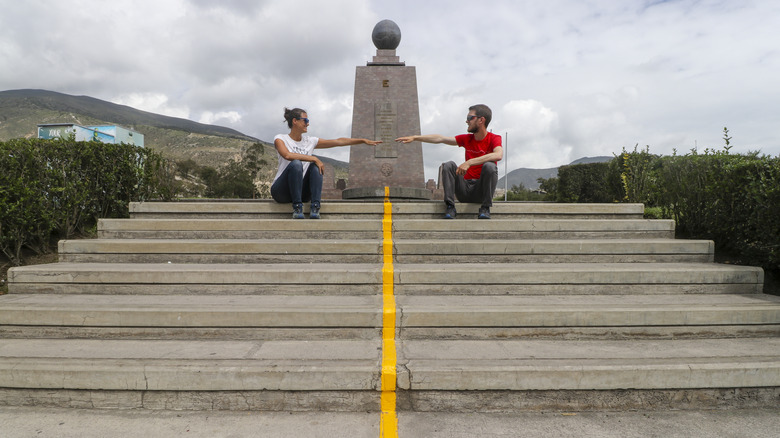 Two tourists at "La Mitad del Mundo"