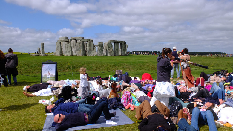 People gathering next to Stonehenge