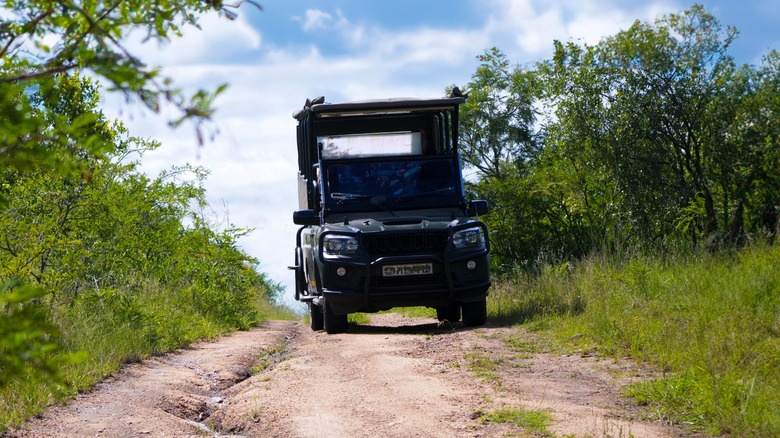 An off-road vehicle driving through the countryside
