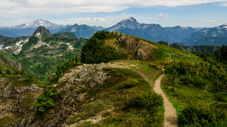 A mountain path wirh peaks in the distance