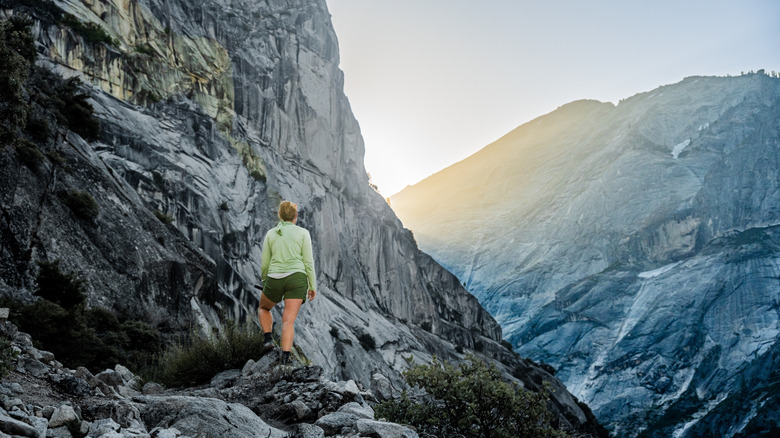 A hiker pauses to look at the view on the Snow Creek Trail