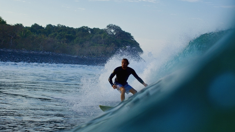 Surfer on a wave in Chacala, Mexico