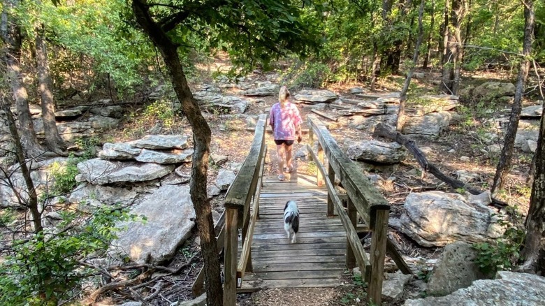 A woman and her dog on Skull Hollow Nature Trail