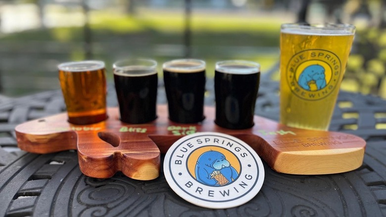Beers on a board shaped like a manatee
