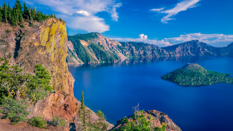 Crater Lake surrounded by cliff bluffs in Oregon