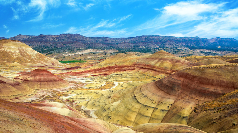 Brightly colored Painted Hills Oregon against blue sky