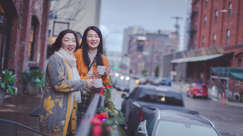 Two women enjoying cups of coffee in Portland, Oregon