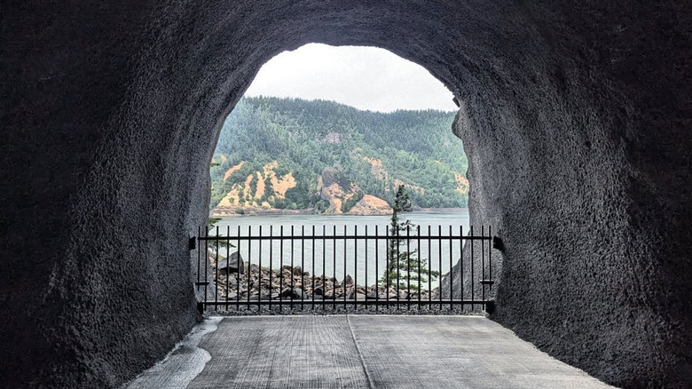 Rock window with gate overlooking river