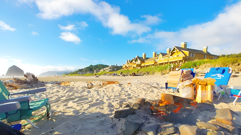 Beach bonfire setup near The Ocean Lodge in Cannon Beach, Oregon, with chairs on the sand