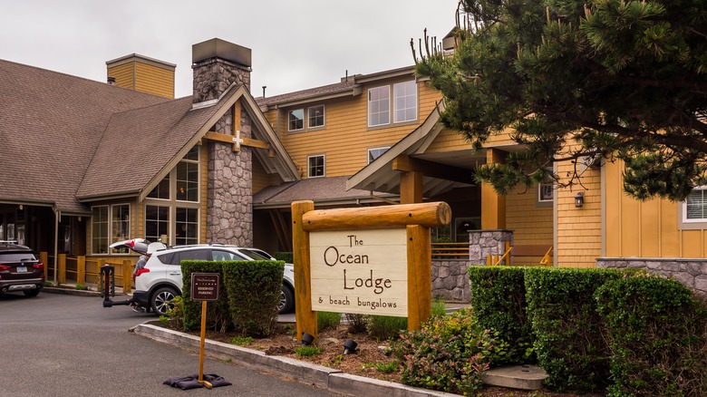 Exterior of The Ocean Lodge in Cannon Beach, Oregon, with its sign and lodge buildings visible