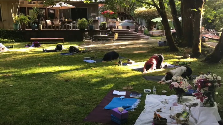People practicing yoga at Tipi Village Retreat