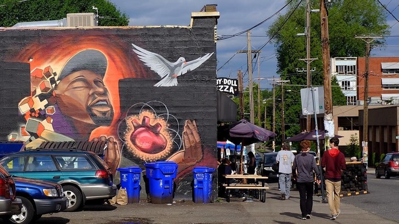 Mural of man and dove on building in Kerns
