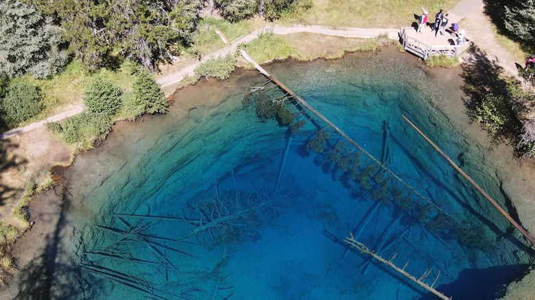 An aerial view of the crystal-clear water at Little Crater Lake