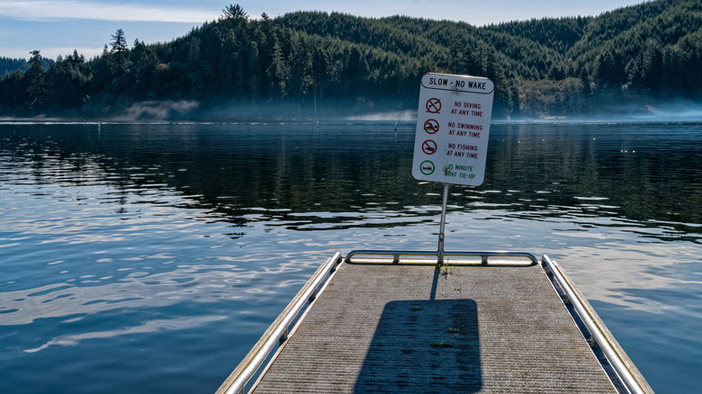 A sign stands at the end of a dock on Tenmile Lake in Oregon
