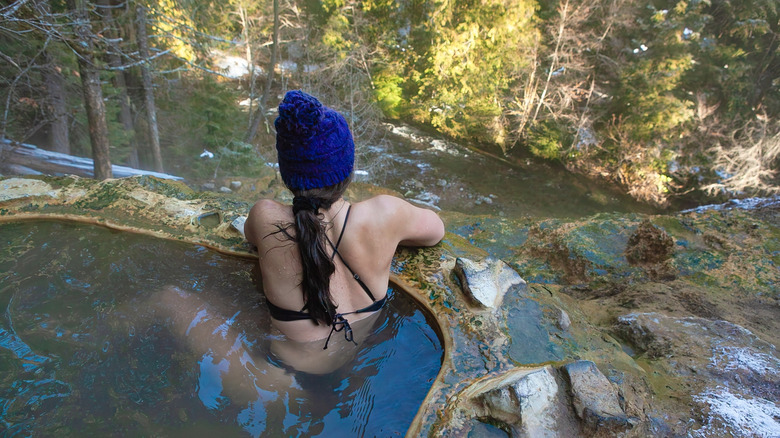 A woman soaking in the Umpqua Hot Springs