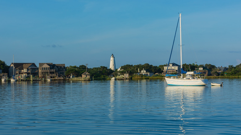 Sailboat anchored near the Ocracoke lighthouse in Silver Lake harbor