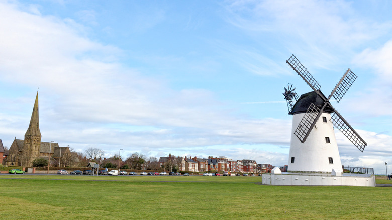 A white windmill on a green lawn in the coastal town of Lytham St. Annes