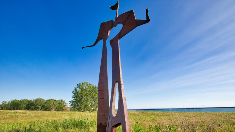 A giant metal sculpture in a field