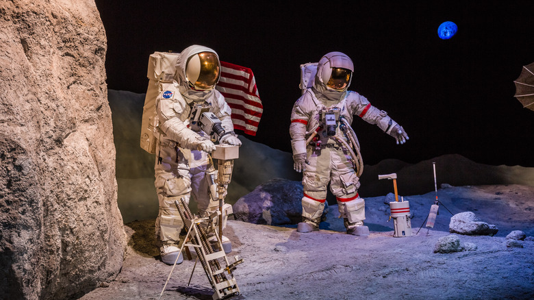 Replica of astronauts in spacesuits