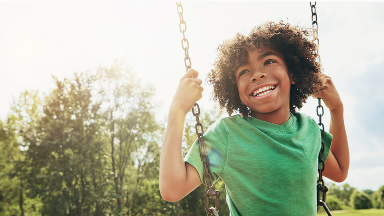 Kid enjoying himself in the park