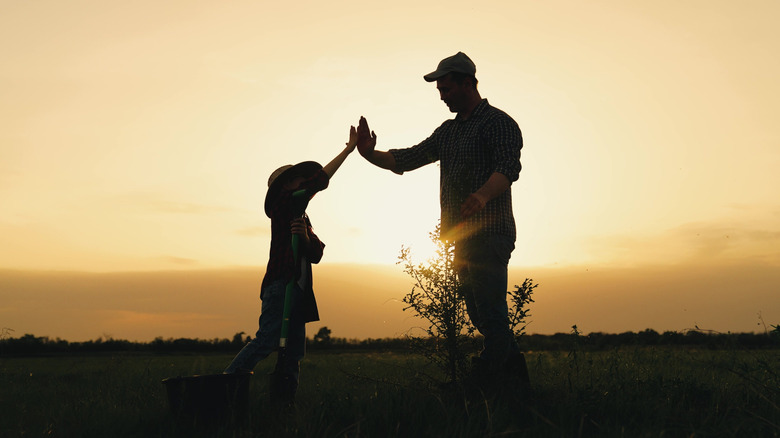 Father and son bond in an open prairie