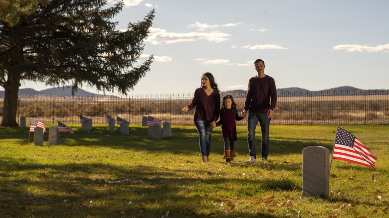 A family exploring the Camp Floyd Cemetery