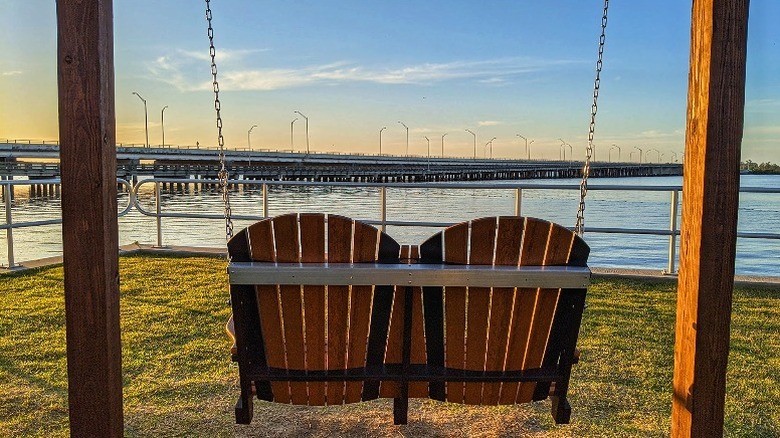 Swing chairs overlooking the water at Leslie Porter Park in Lynn Haven.