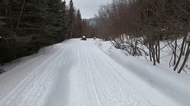 Snowmobiles riding on a ski trail in Pasadena