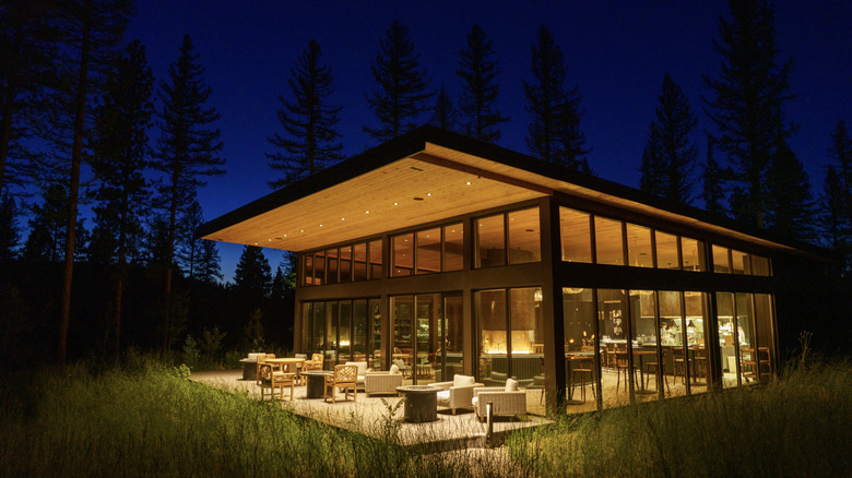 Exterior of the modern and luxurious Social Haus at Paws Up Montana at nighttime