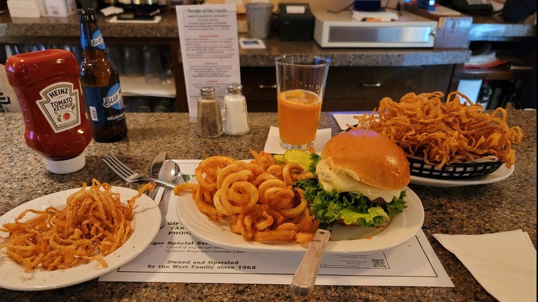 A burger, curly fries, and onion rings at Allentown dining institution Wert's Cafe