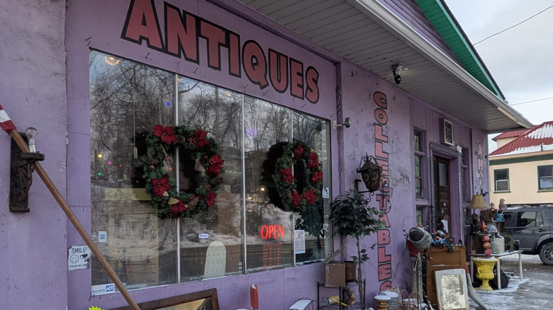 The purple facade, Christmas decorations, and knickknacks outside of Antique Mall at Ohio River