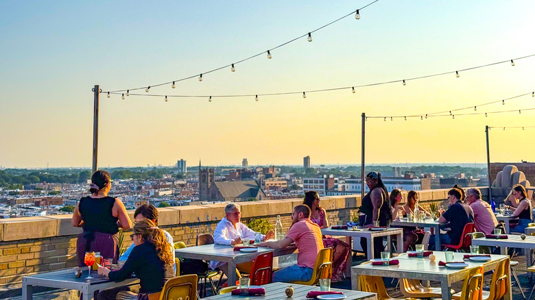 People dine at a rooftop restaurant in Philadelphia