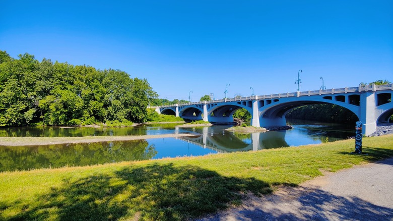 Bridge crossing a quiet river at Pottstown Riverfront Park, PA