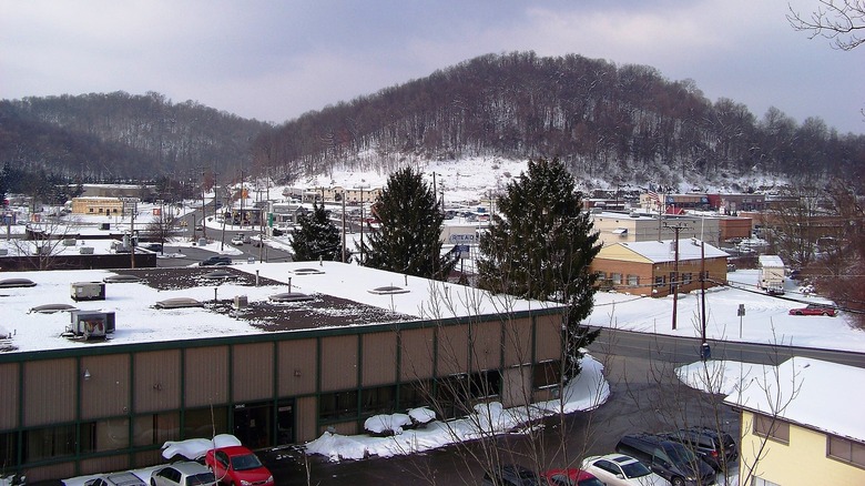 Monroeville in the winter with snow-covered buildings and bare trees.
