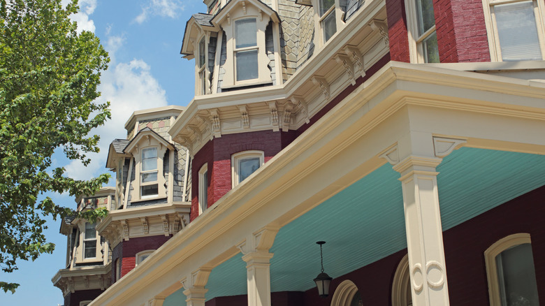 Close up of Victorian house detail, including intricate moldings and slate roof tiles