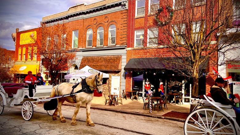 Horse and cart moving through street in Vandergrift, PA