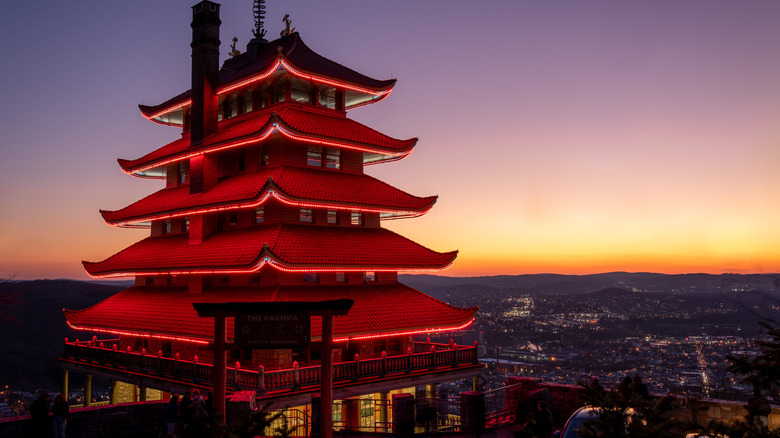 The Reading Pagoda glowing in red neon at night