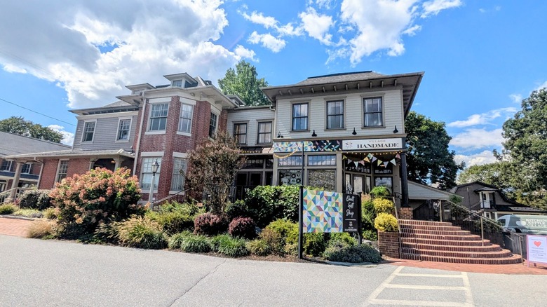 A handmade quilt shop on a sunny day at Kitchen Kettle Village in Pennsylvania.