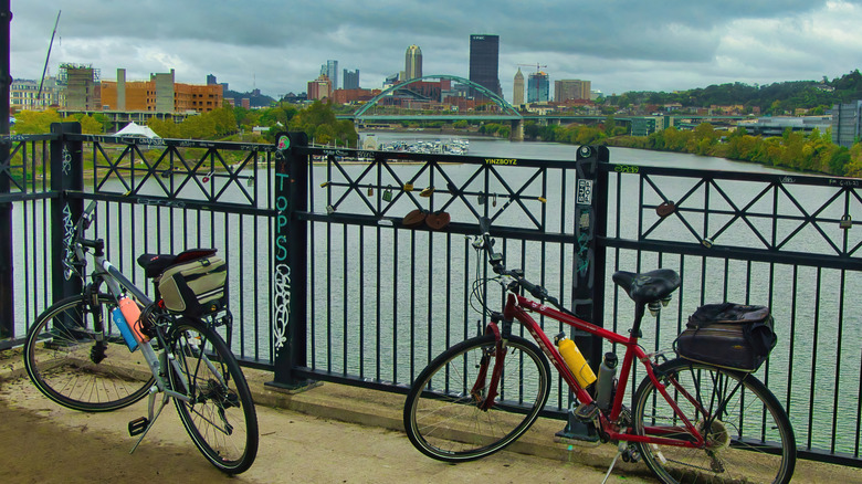 Bikes on a bridge overlooking Pittsburgh's skyline