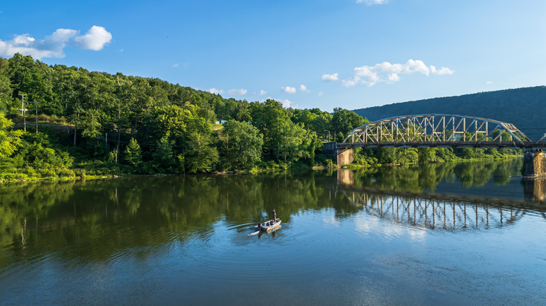 small boat approaching a bridge on the Allegheny river