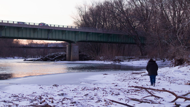 A person walking along the Schuylkill River
