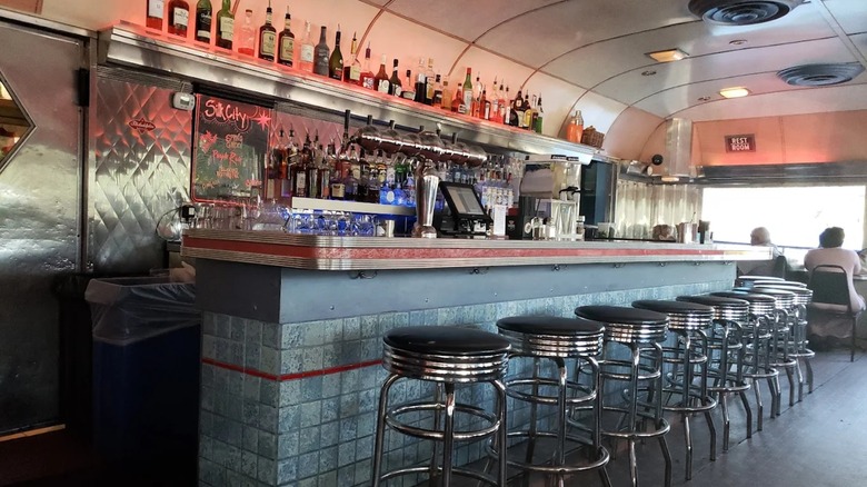 The interior of Silk City diner with people sitting at the bar stools