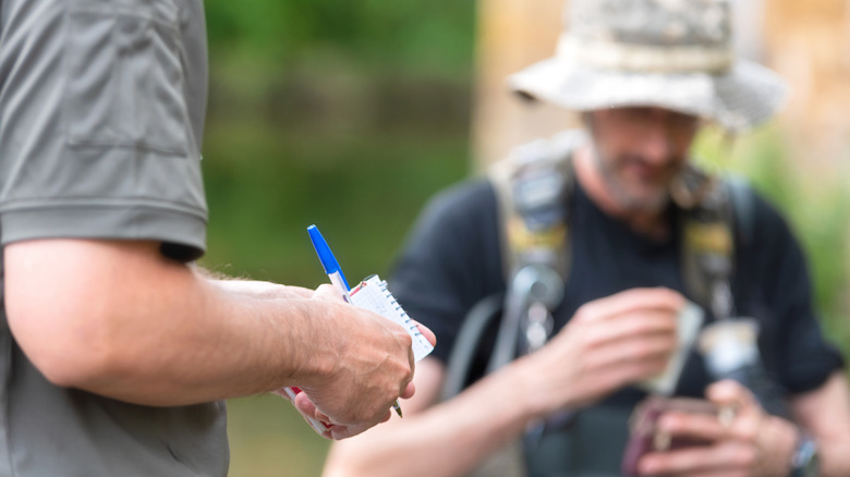 Officer checking angler's fishing license