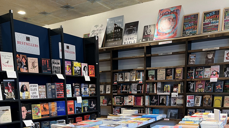 Alphabet City interior, with black shelves of books